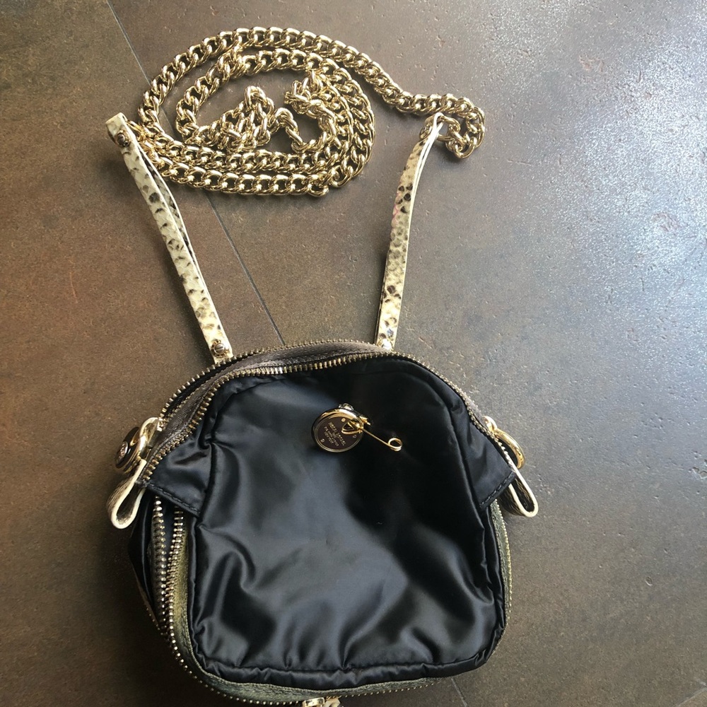 Henri Bendel crossbody Bag with gold chain.